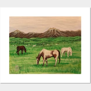 Horses grazing near the mountain range Posters and Art